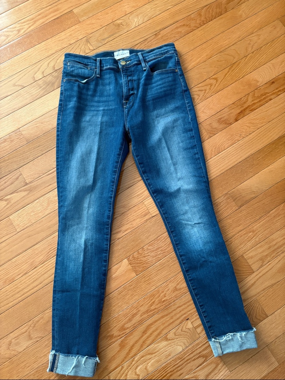 Frame Denim Skinny Jeans in Medium-Dark Blue Wash with Frayed Hem